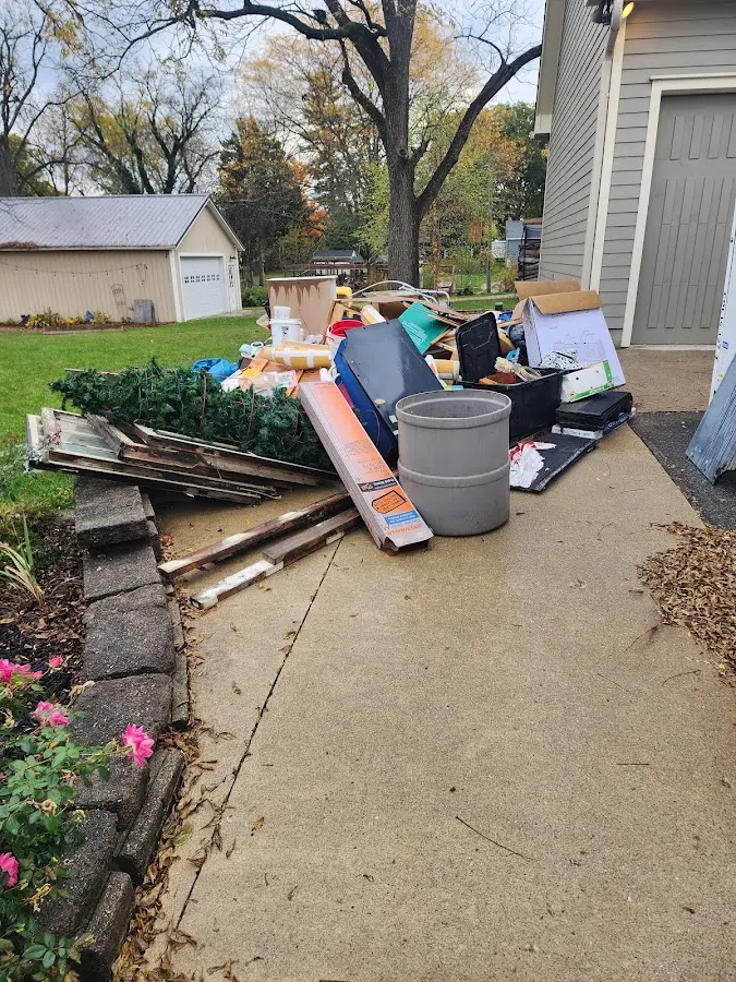 Dumpster being loaded with debris for Residential Dumpster Rental in Wilson's Mills